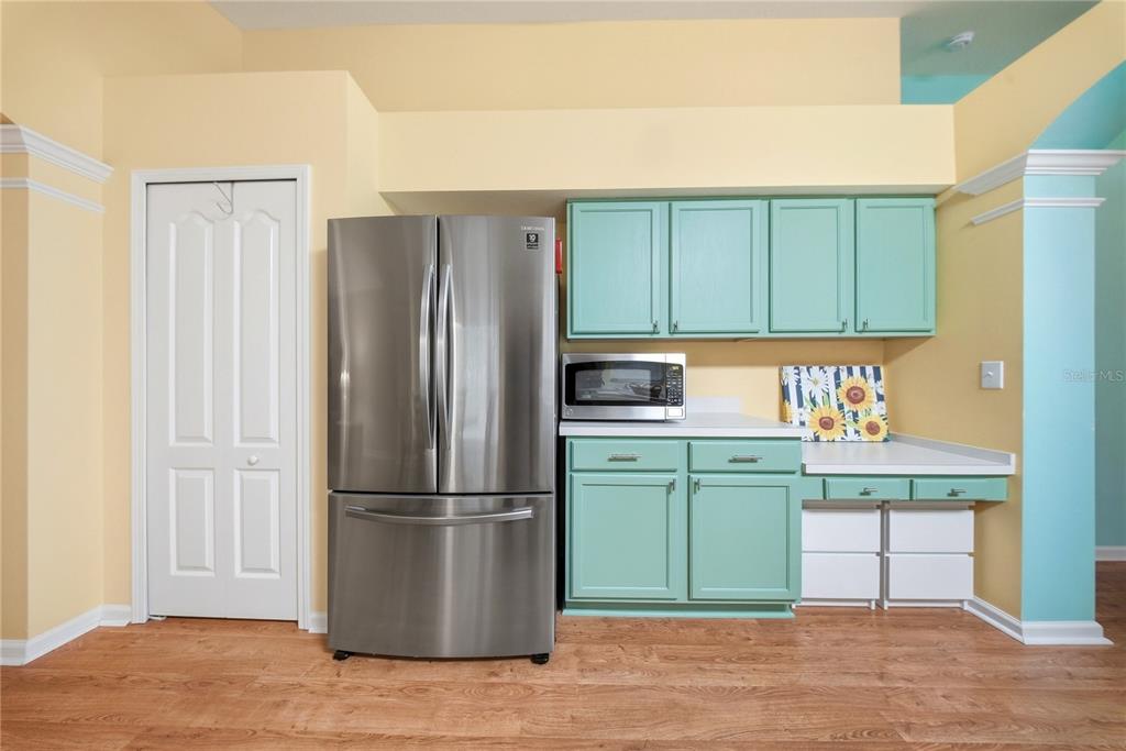 5856 Count Turf Lane Wesley Chapel, FL 33544 - Photo 30 of 57 a kitchen with a refrigerator and a sink