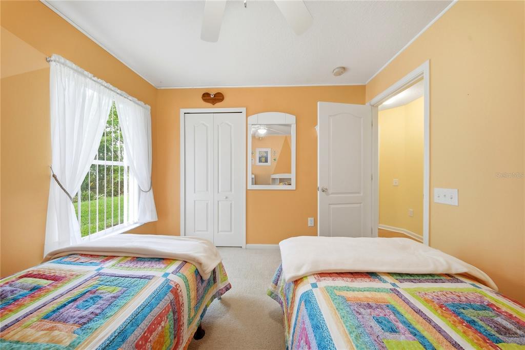 5856 Count Turf Lane Wesley Chapel, FL 33544 - Photo 36 of 57 a bedroom with a bed and a window
