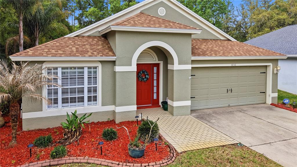 5856 Count Turf Lane Wesley Chapel, FL 33544 - Photo 40 of 57 a front view of a house with balcony
