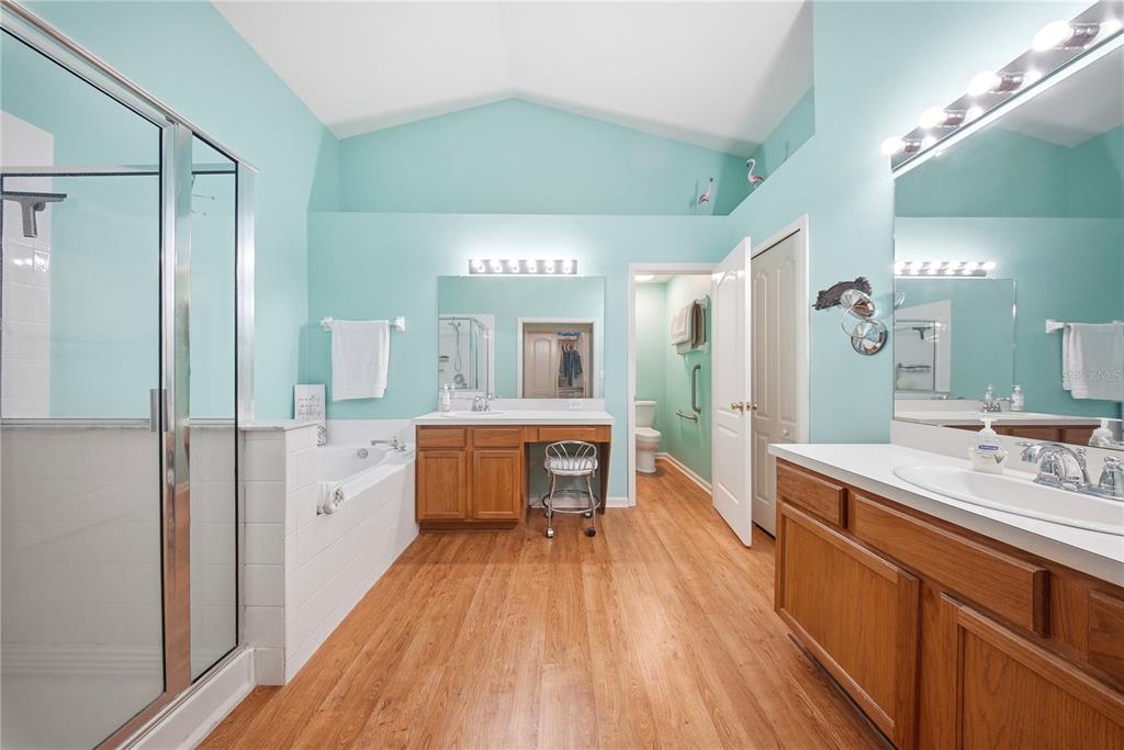 5856 Count Turf Lane Wesley Chapel, FL 33544 - Photo 6 of 57 a large kitchen with a lot of counter space and wooden floor