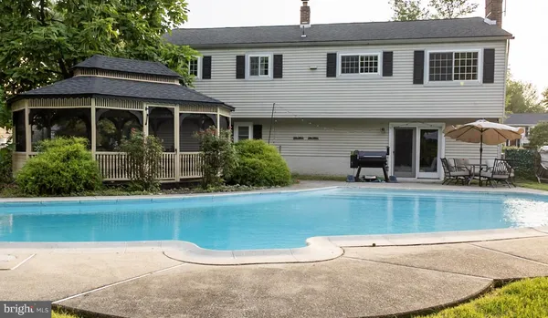 a view of a house with a swimming pool