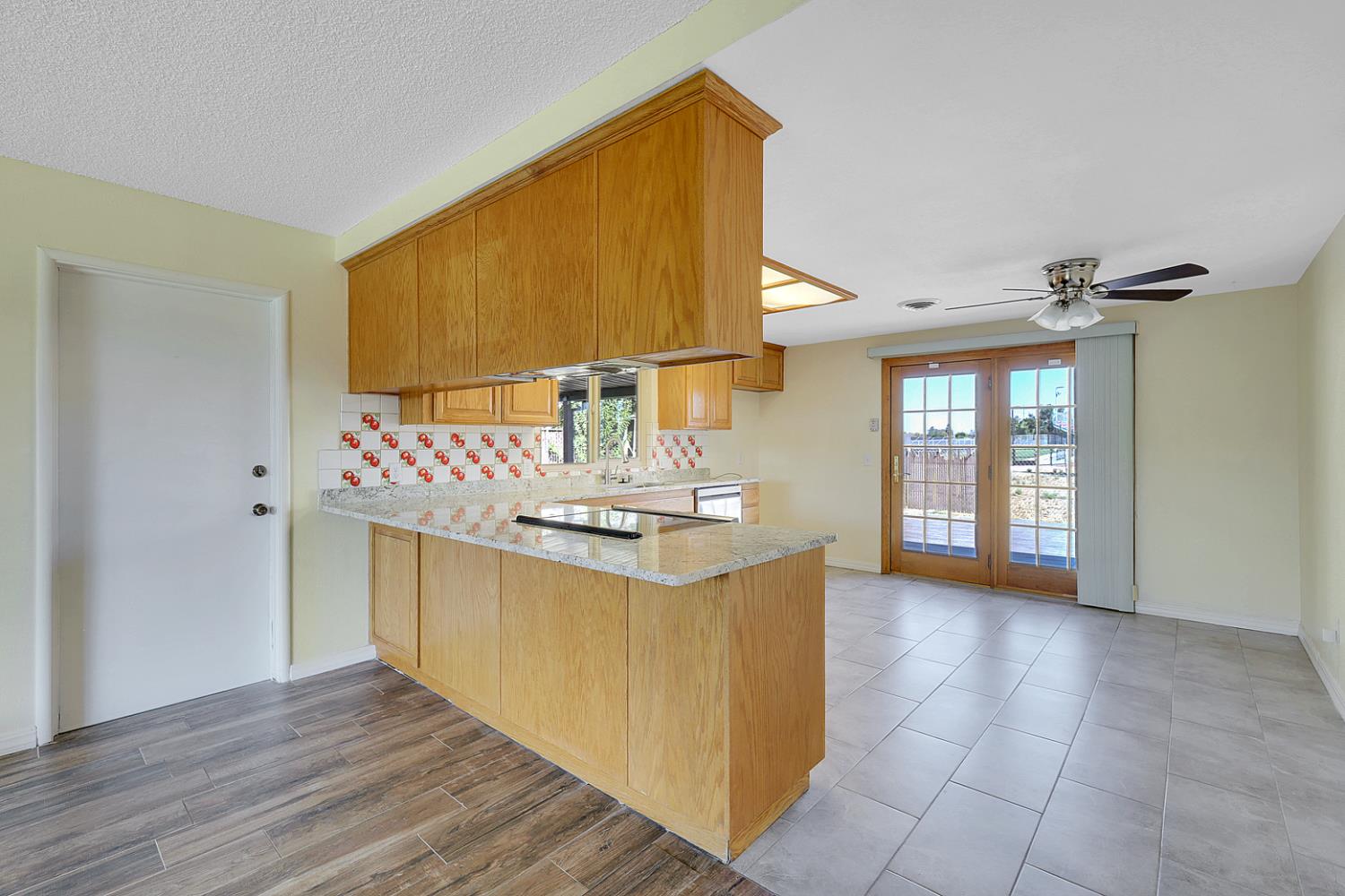 4294 Lever Avenue Olivehurst, CA 95961 - Photo 11 of 32 a kitchen with stainless steel appliances granite countertop a sink and cabinets