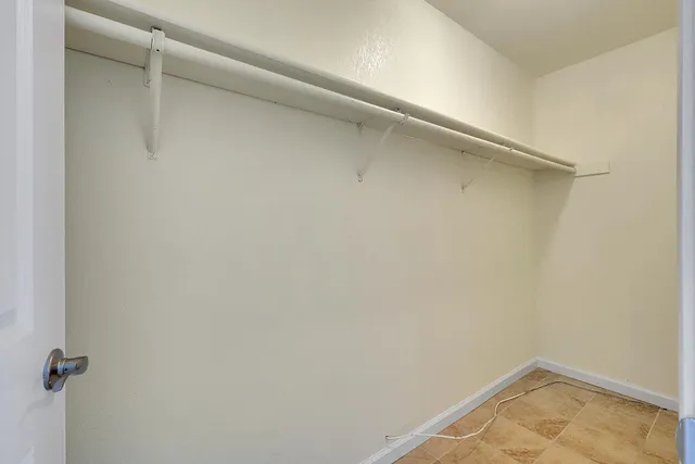 a view of a room with shelf on the wall