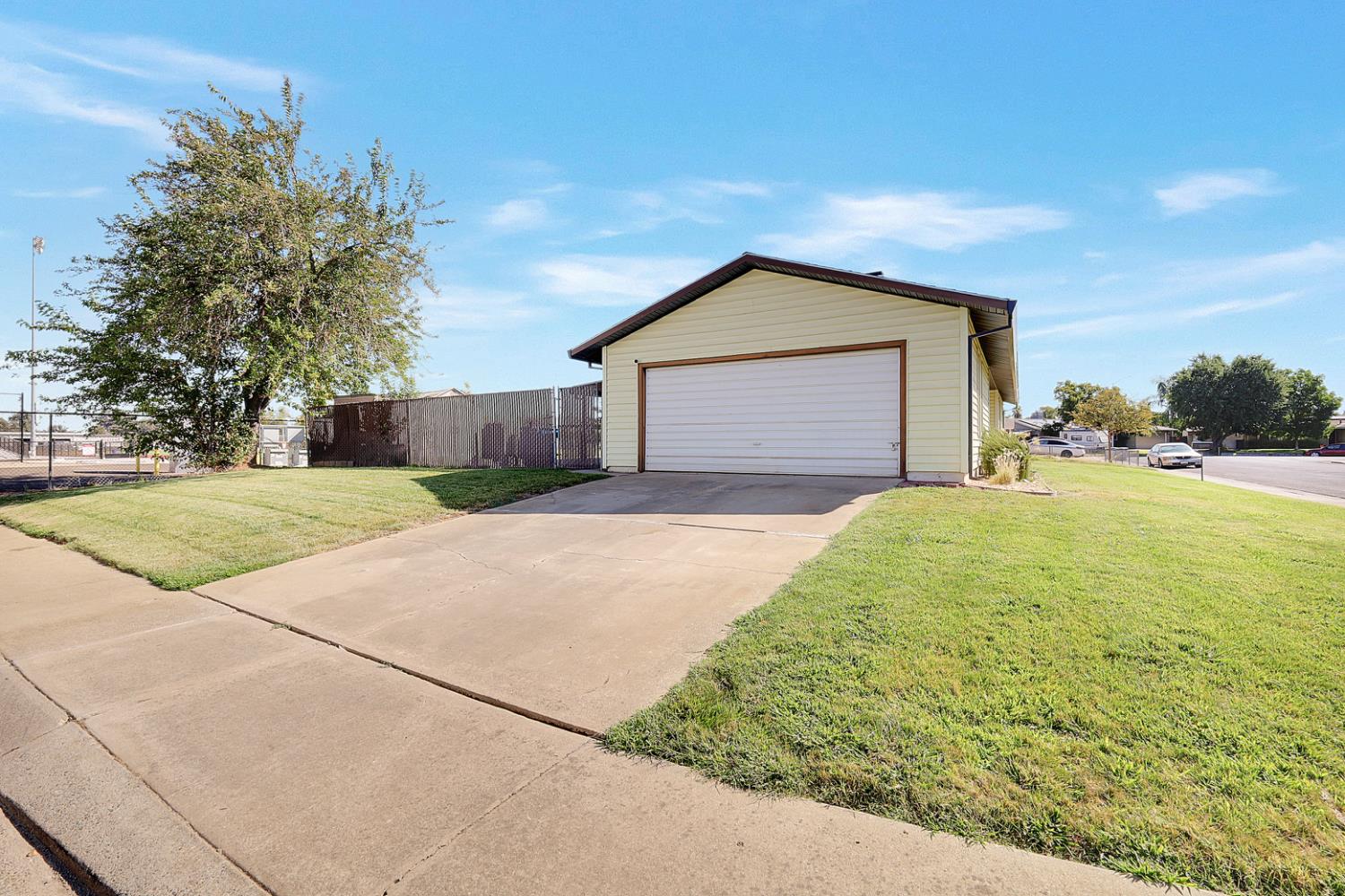 4294 Lever Avenue Olivehurst, CA 95961 - Photo 5 of 32 a front view of a house with a yard and garage