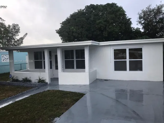 a view of house with backyard