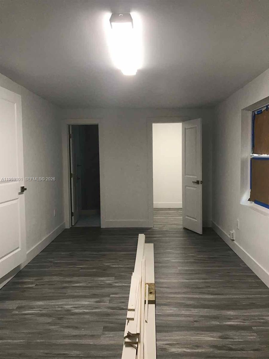 1920 Rutland Street Opa-Locka, FL 33054 - Photo 16 of 33 an empty room with wooden floor and windows