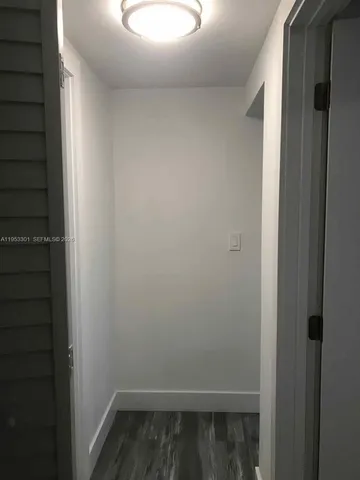 a kitchen with cabinets and stainless steel appliances