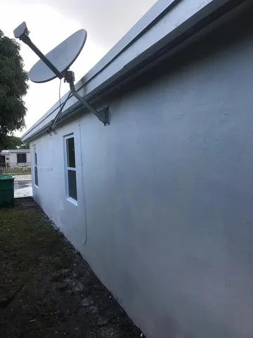 a view of a backyard of the house