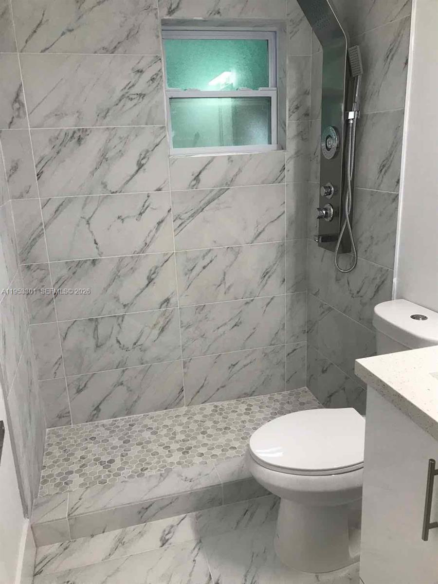 1920 Rutland Street Opa-Locka, FL 33054 - Photo 9 of 33 a bathroom with a toilet and a shower