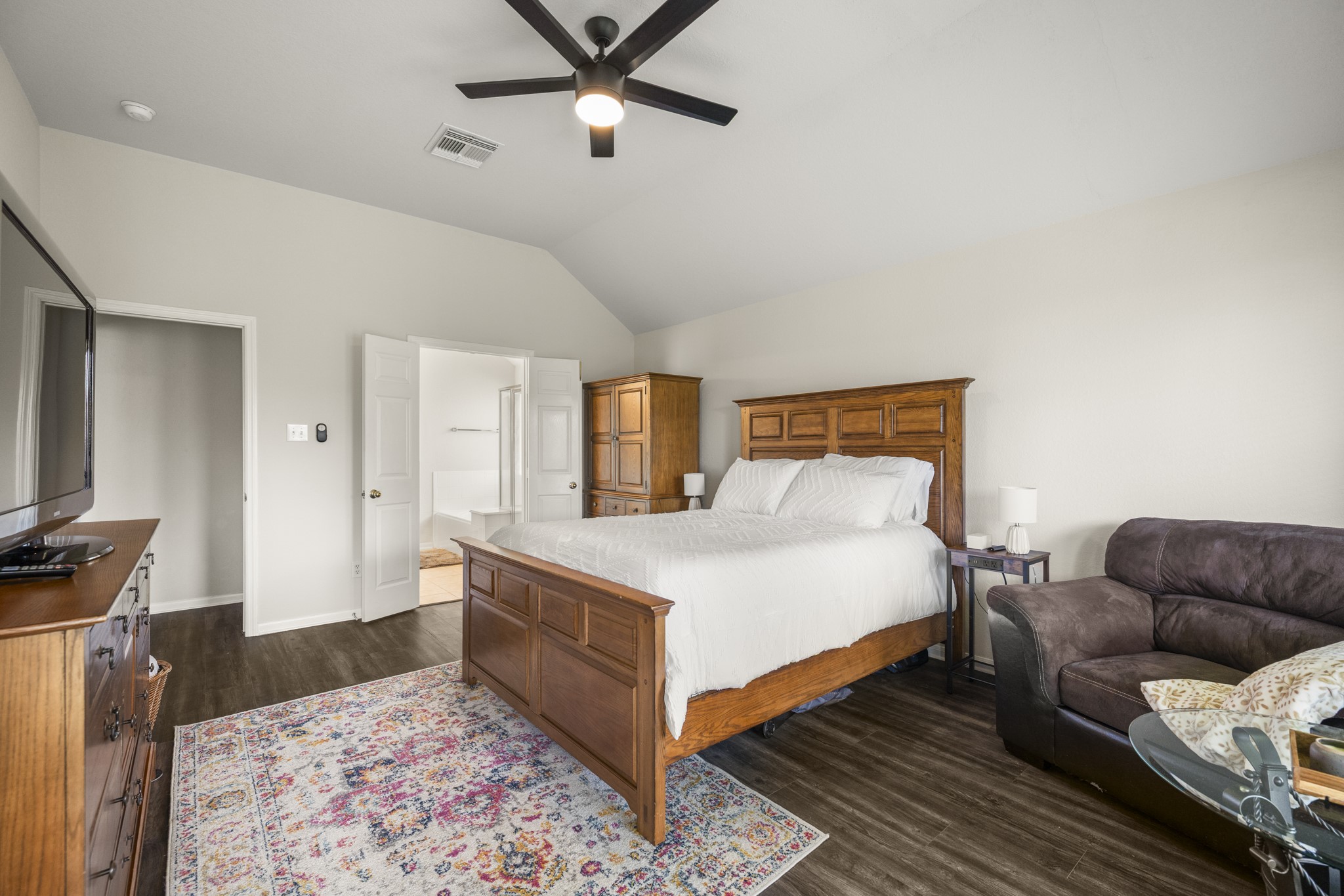 3422 Falcon Trail Court Spring, TX 77373 - Photo 16 of 35 a bedroom with a bed rug and wooden floor