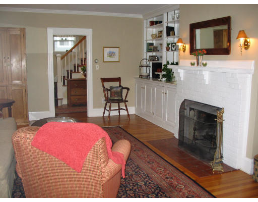 18 Homestead Road Marblehead, MA 01945 - Photo 1 of 15 a bedroom with a bed a chair and potted plant