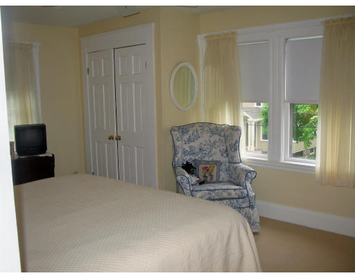 18 Homestead Road Marblehead, MA 01945 - Photo 4 of 15 a bedroom with a bed a mirror on dresser and a window