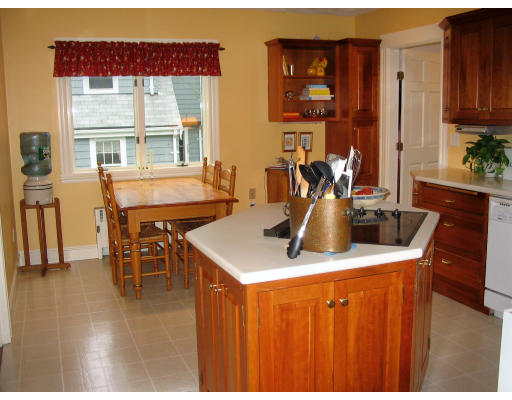 18 Homestead Road Marblehead, MA 01945 - Photo 8 of 15 a dining table with chairs and view kitchen