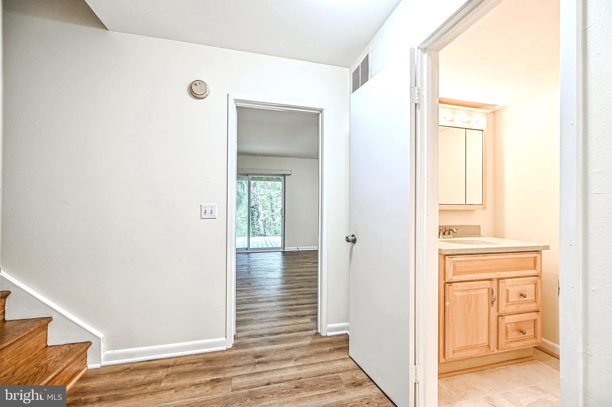 1664 Wainwright Drive Reston, VA 20190 - Photo 26 of 41 Lower Level Landing and Half Bath