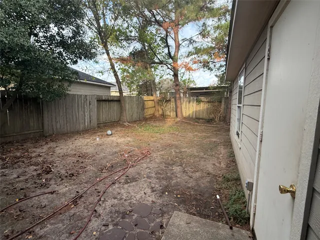 a view of a house with a small yard