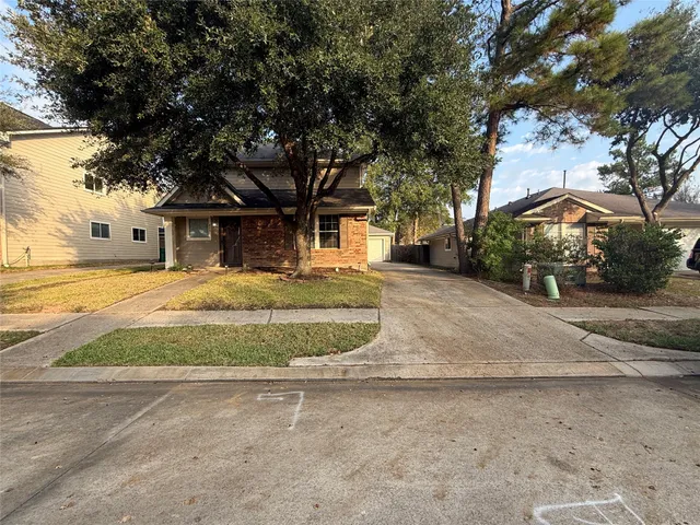 a house with trees in front of it