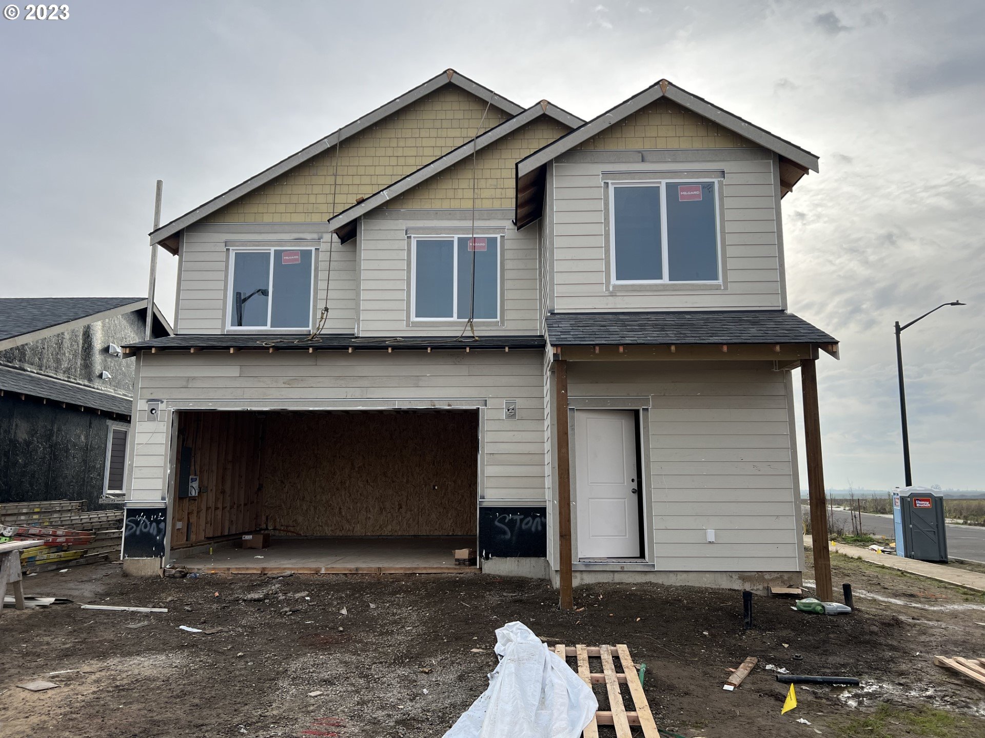a front view of a house with a garage