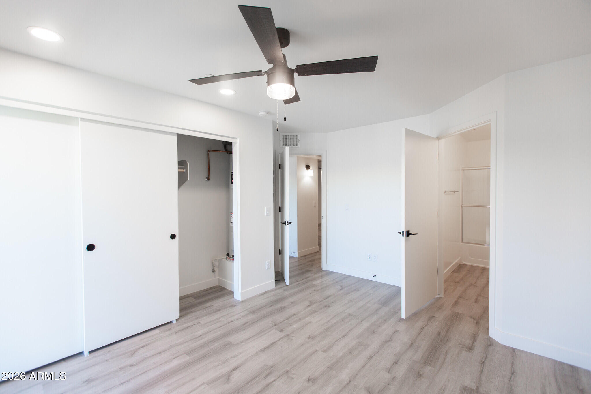 3644 East McDowell Road, Unit 101 Phoenix, AZ 85008 - Photo 18 of 21 a view of an empty room with wooden floor