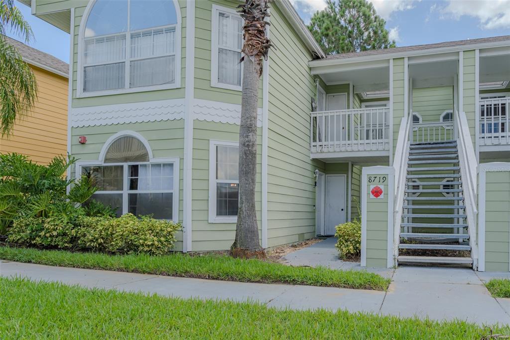 8719 Rockingham Terrace, Unit A Kissimmee, FL 34747 - Photo 1 of 1 a front view of a house with a garden and plants