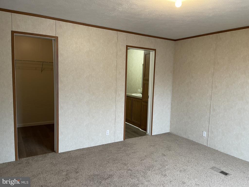 4250 Delta Road Airville, PA 17302 - Photo 7 of 12 an empty room with closet and mirror