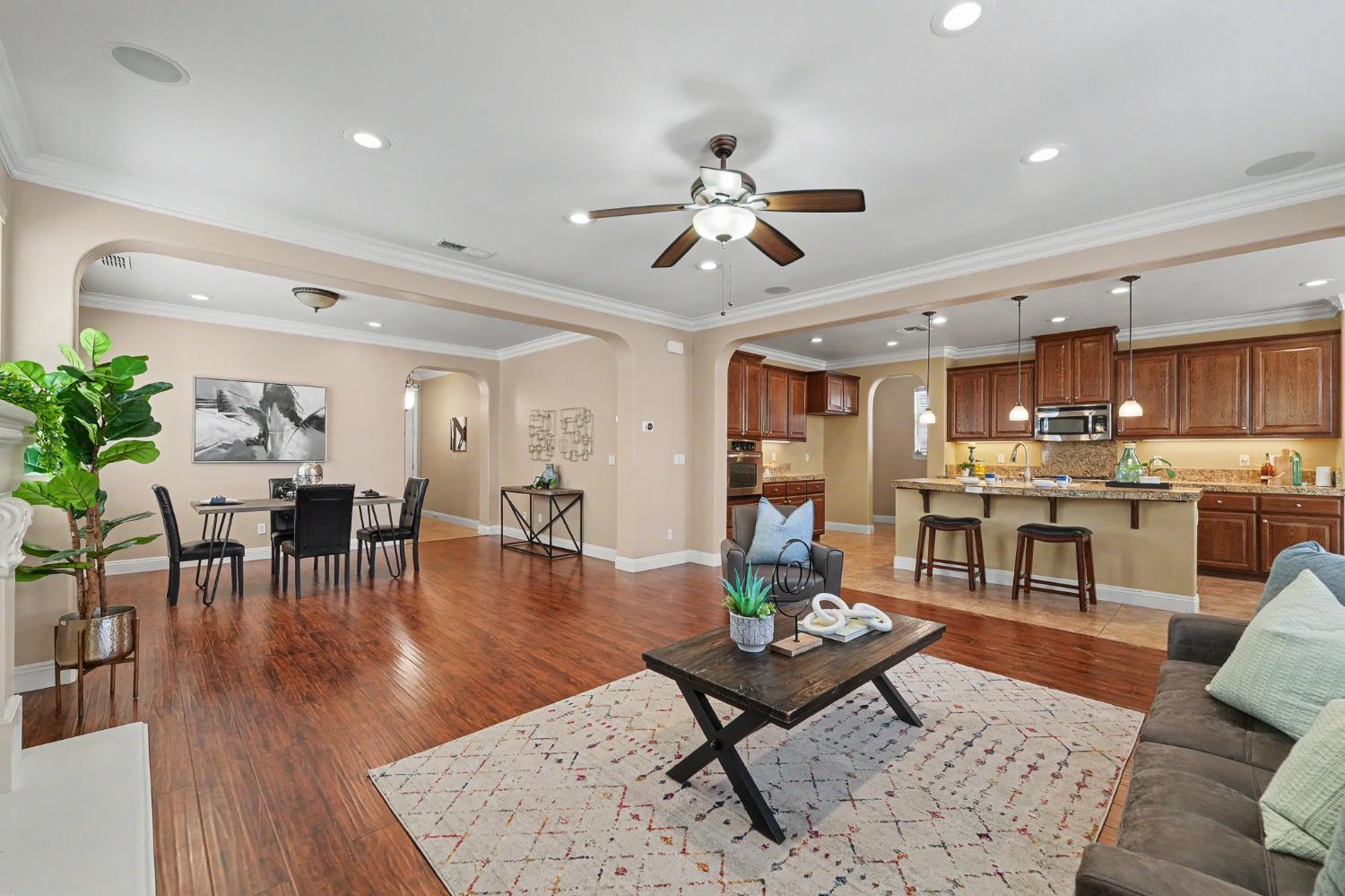 1223 East Springer Drive Turlock, CA 95382 - Photo 13 of 48 a living room with furniture and kitchen view