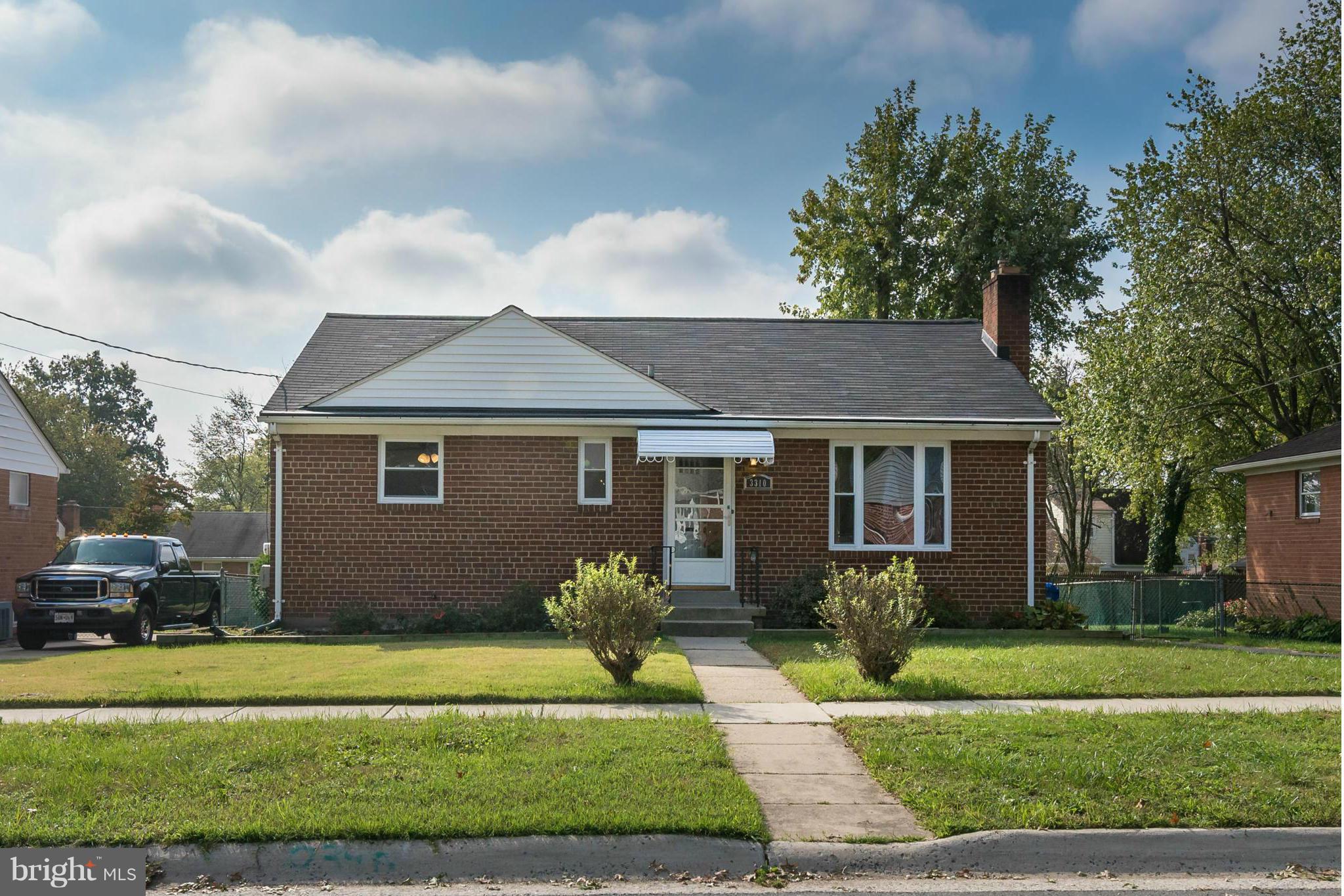 3310 Harrell Street Silver Spring, MD 20906 - Photo 1 of 26 a front view of a house with a garden
