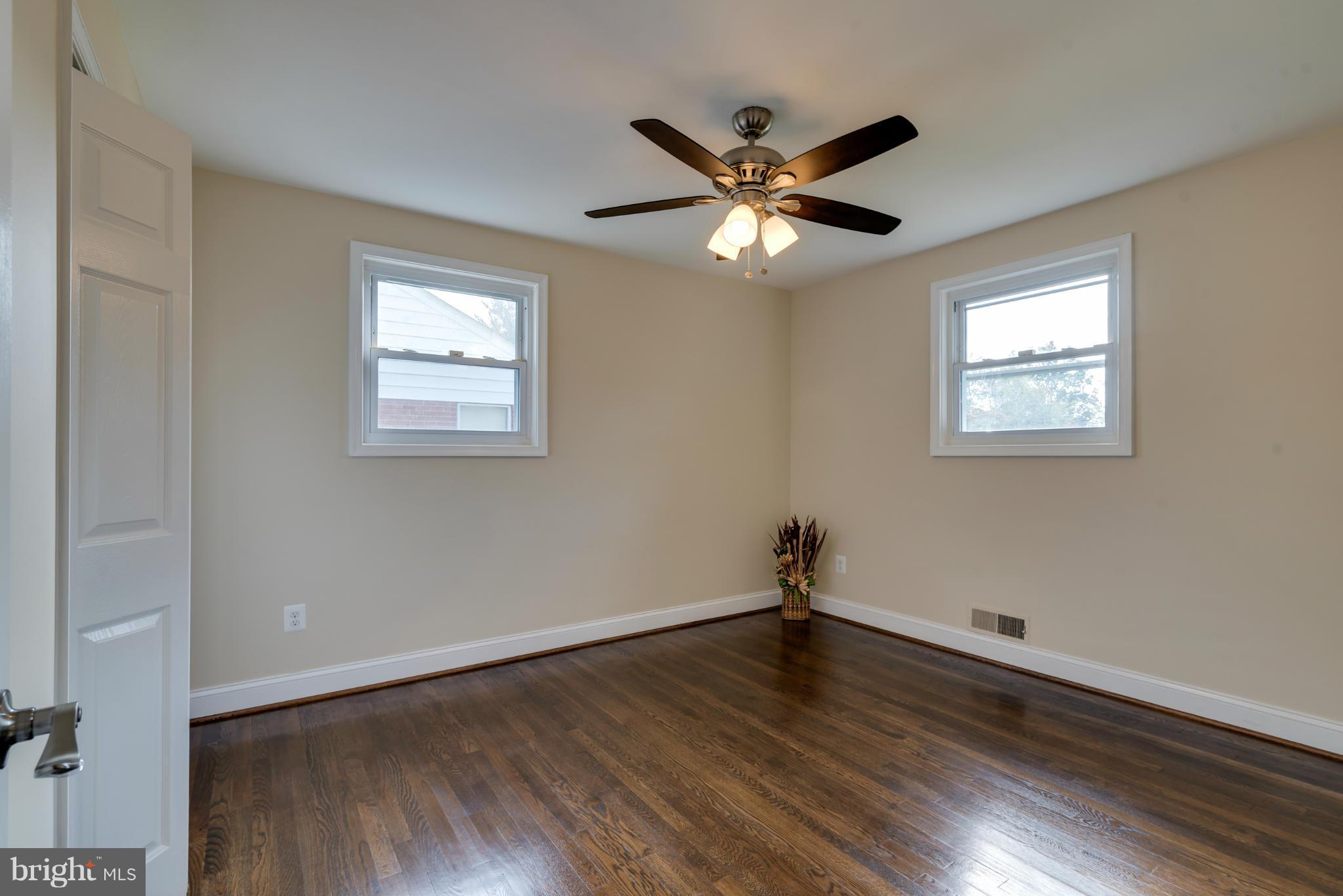 3310 Harrell Street Silver Spring, MD 20906 - Photo 16 of 26 a view of a big room with wooden floor and windows
