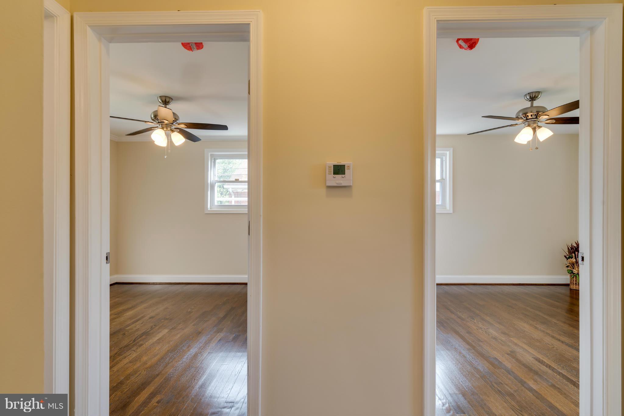 3310 Harrell Street Silver Spring, MD 20906 - Photo 17 of 26 a view of a hallway with wooden floor