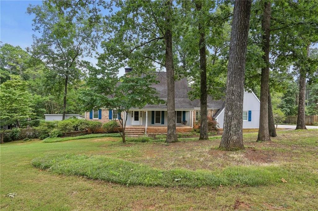 5622 Williamsburg Drive Northwest Norcross, GA 30093 - Photo 13 of 29 front view of a house with a yard
