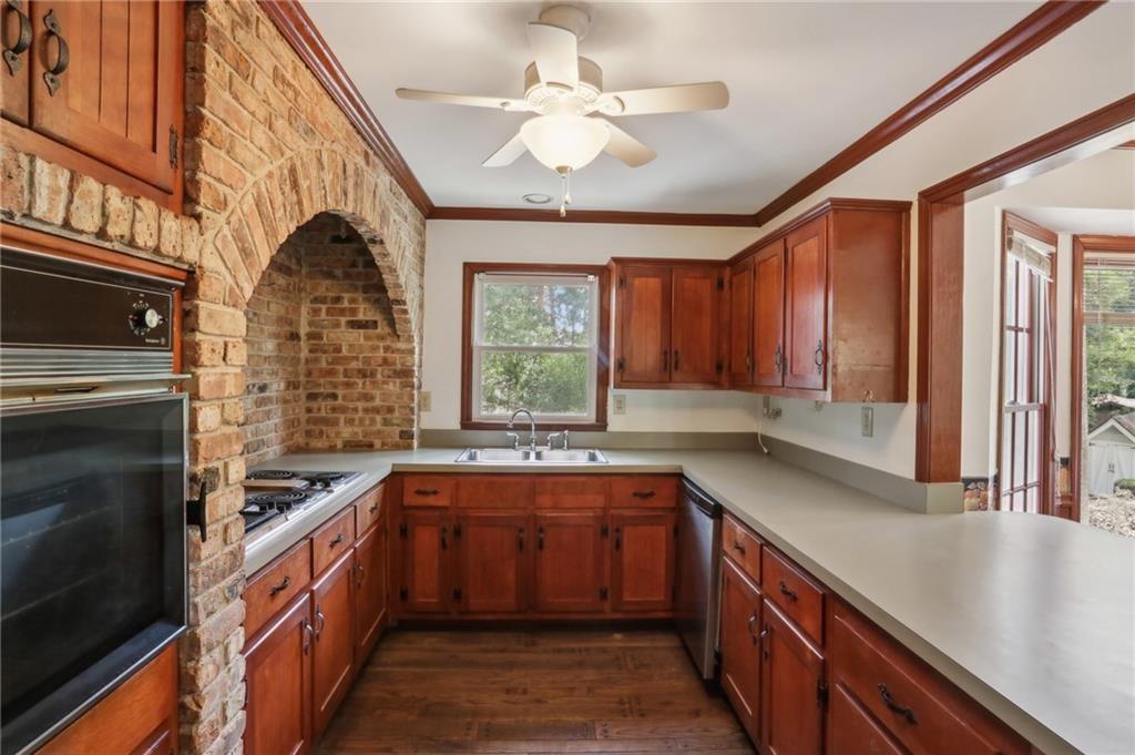 5622 Williamsburg Drive Northwest Norcross, GA 30093 - Photo 20 of 29 a kitchen with a sink stove and cabinets