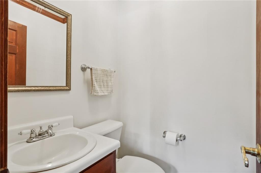 5622 Williamsburg Drive Northwest Norcross, GA 30093 - Photo 24 of 29 a bathroom with a sink mirror and toilet