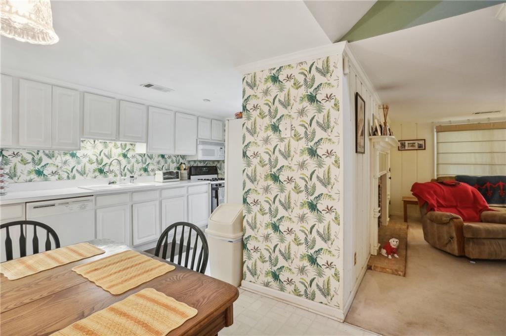 5622 Williamsburg Drive Northwest Norcross, GA 30093 - Photo 28 of 29 a bedroom with a bed and a couch