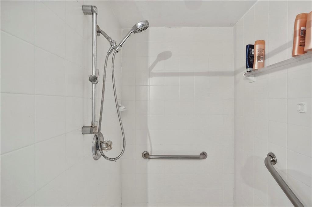 5622 Williamsburg Drive Northwest Norcross, GA 30093 - Photo 29 of 29 a bathroom with a shower