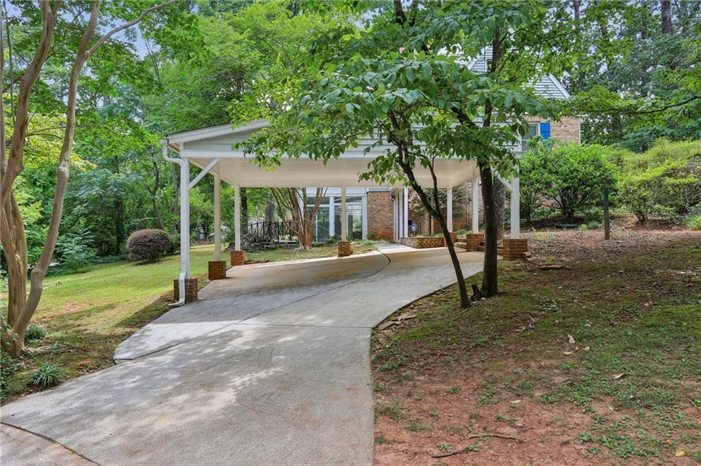 5622 Williamsburg Drive Northwest Norcross, GA 30093 - Photo 4 of 29 a view of a street with a tree