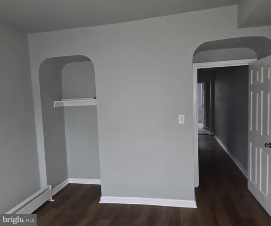 a kitchen with a refrigerator and window