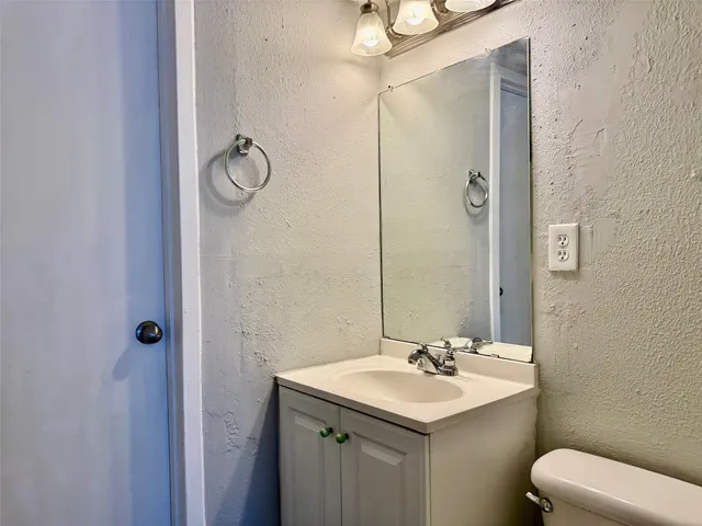 a view of a backyard with wooden fence