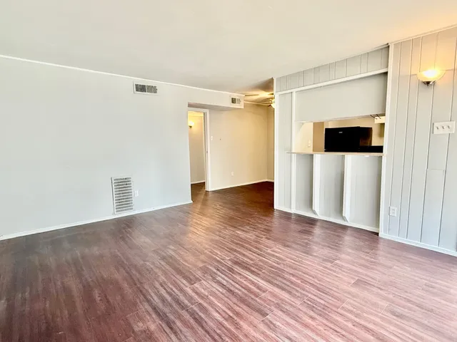 a kitchen with a refrigerator and a stove