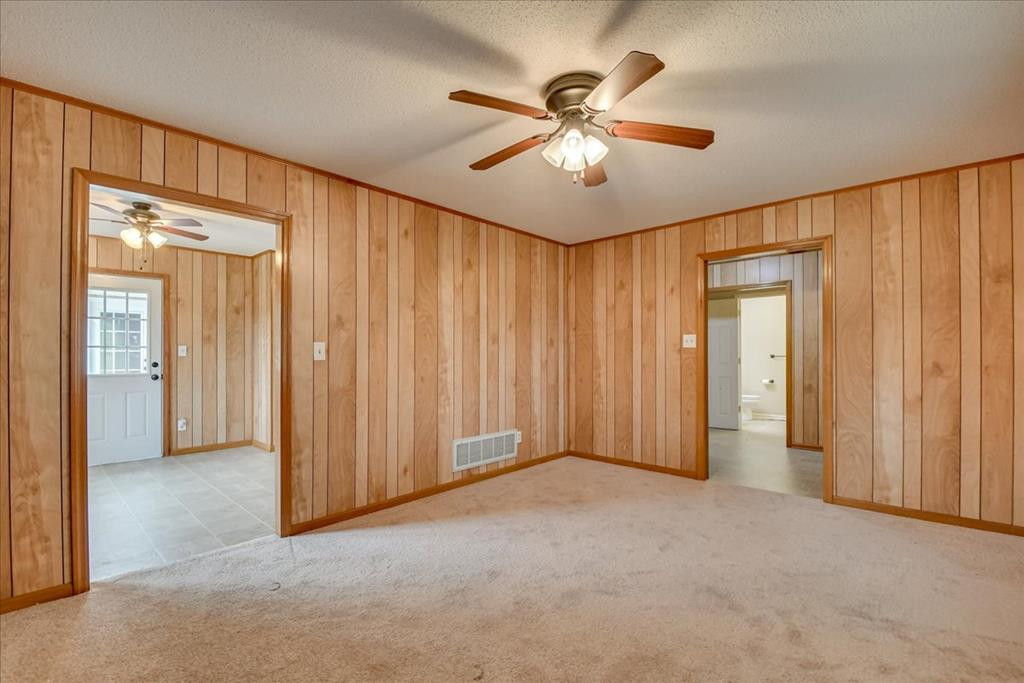 1673 Coleman Bridge Road Wagener, SC 29164 - Photo 10 of 45 an empty room with windows and closet area