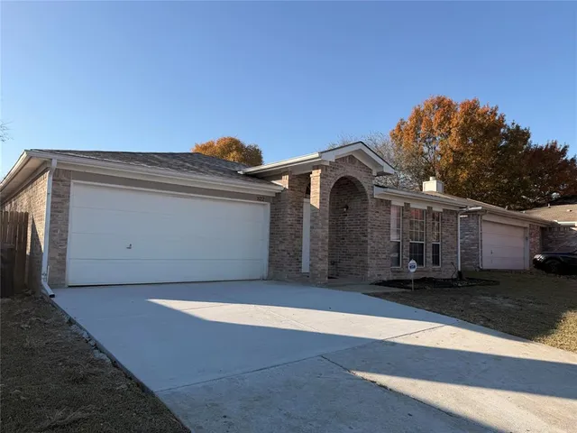 a front view of a house with a garage