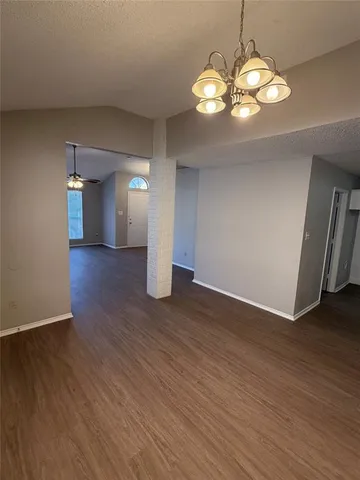a view of a livingroom with wooden floor
