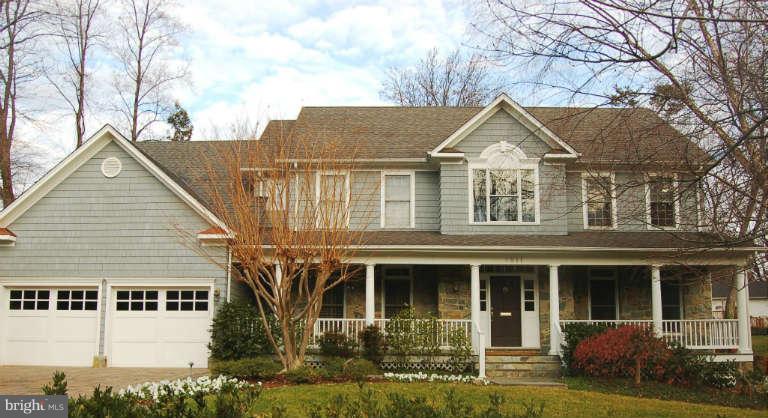 5511 Cornish Road Bethesda, MD 20814 - Photo 1 of 30 a view of a white house with large windows and a small yard