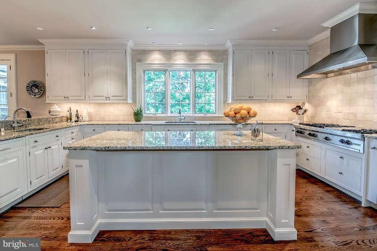 5511 Cornish Road Bethesda, MD 20814 - Photo 11 of 30 a kitchen with granite countertop a stove a sink and a granite counter tops