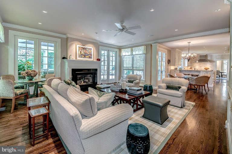5511 Cornish Road Bethesda, MD 20814 - Photo 13 of 30 a living room with furniture fireplace and large windows