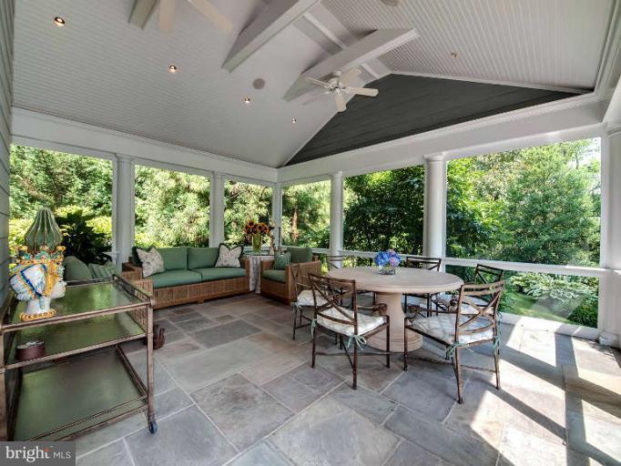 5511 Cornish Road Bethesda, MD 20814 - Photo 16 of 30 a living room with patio furniture and a floor to ceiling window