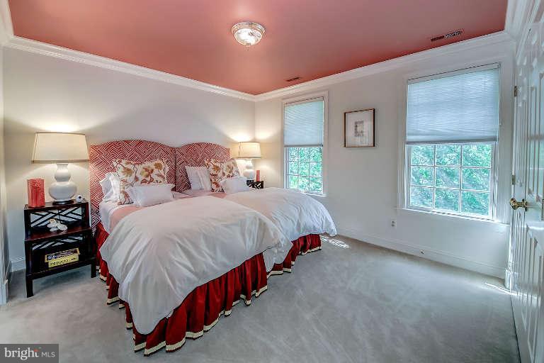 5511 Cornish Road Bethesda, MD 20814 - Photo 21 of 30 a spacious bedroom with a bed and a window
