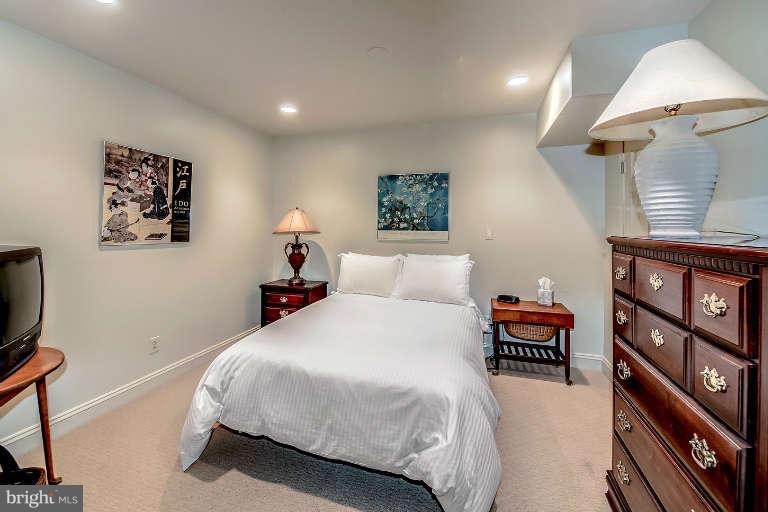 5511 Cornish Road Bethesda, MD 20814 - Photo 26 of 30 a bedroom with a bed and a night stand