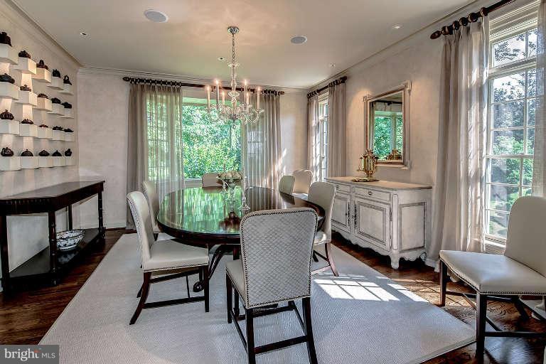 5511 Cornish Road Bethesda, MD 20814 - Photo 6 of 30 a dining room with furniture a chandelier and wooden floor