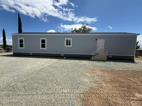 a house view with a backyard space