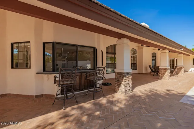 a view of a house with pool porch and furniture