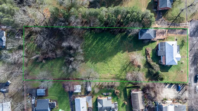 a aerial view of a house with a lake view